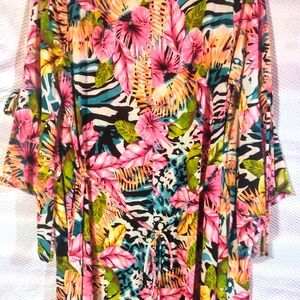 Tropical vacation fun dress. Very cute. Knee length, 3/4 sleeves, ties around